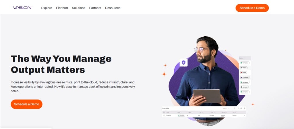The homepage of Vasion, a cloud-based print management solution, showing a man holding a tablet.