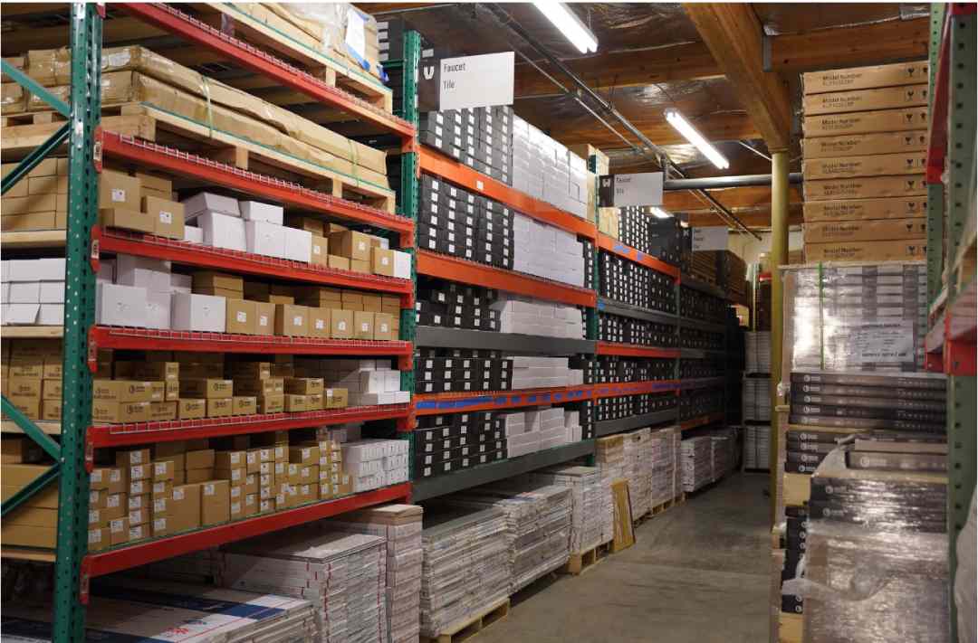 Warehouse shelves stacked with organized inventory boxes and pallets for ecommerce fulfillment