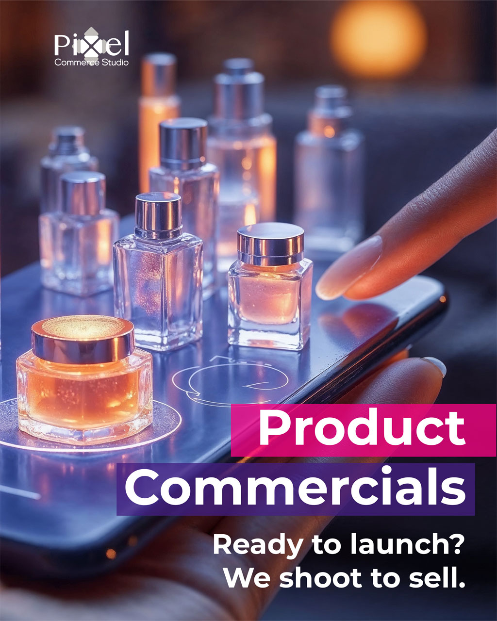 Promotional image for Pixel Commerce Studio's product commercial services, showing professionally shot cosmetic bottles on a smartphone screen with the text 'Product Commercials: Ready to launch? We shoot to sell.
