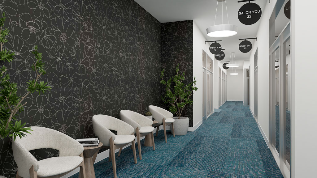 3D rendering of a modern salon hallway with a blue carpet, a waiting area with stylish chairs against a dark floral wallpaper, and hanging signs for 'SALON YOU' rooms.